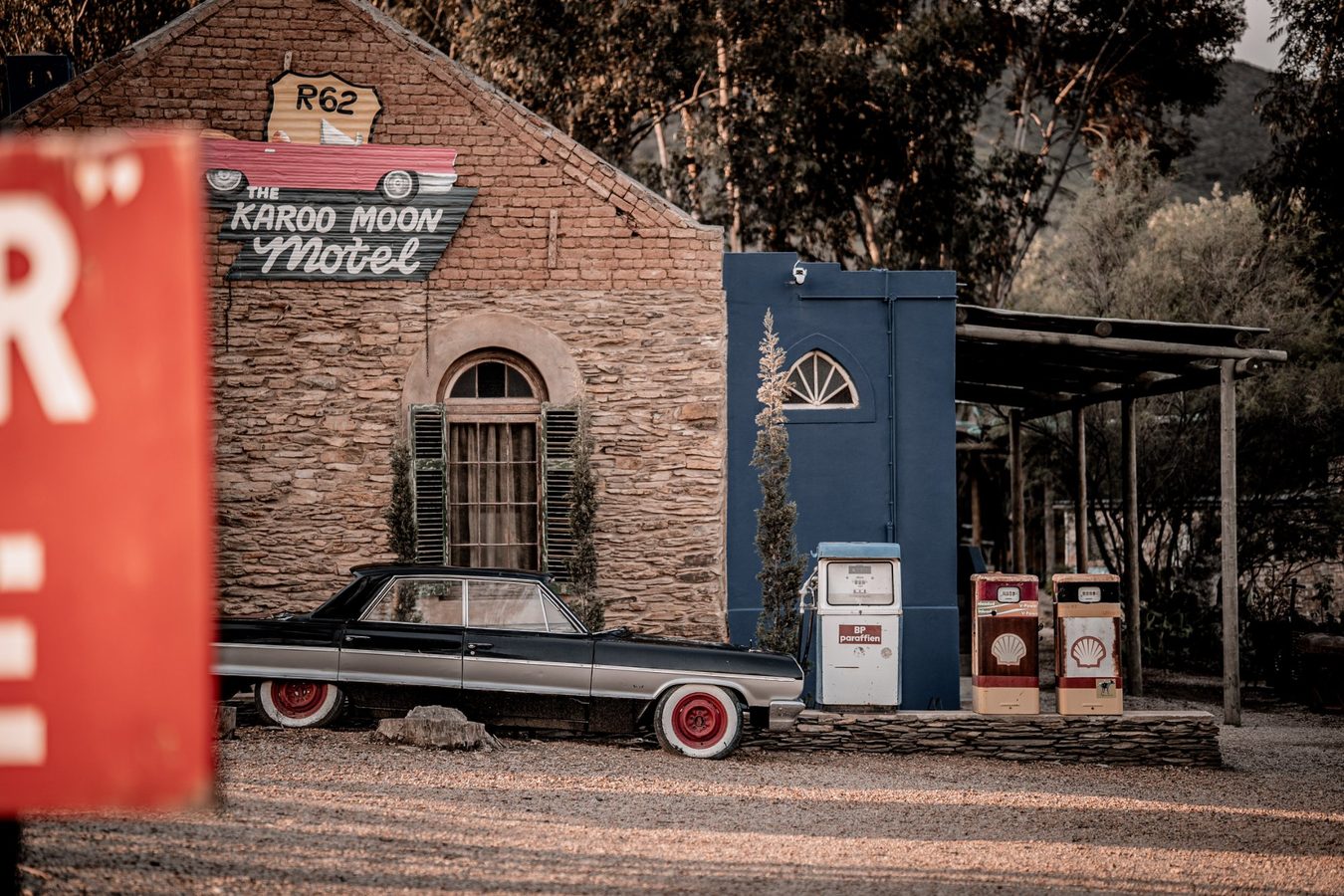 Karoo Moon Motel with vintage car and Route 62 sign, Barrydale